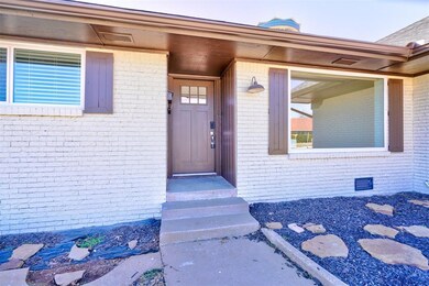 View of exterior entry with brick siding and crawl