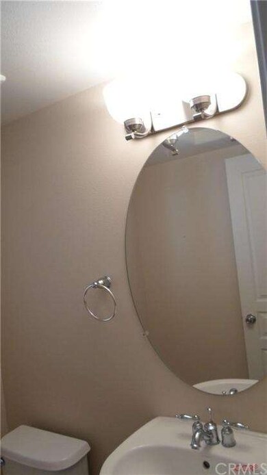 Guest half bath off entry.