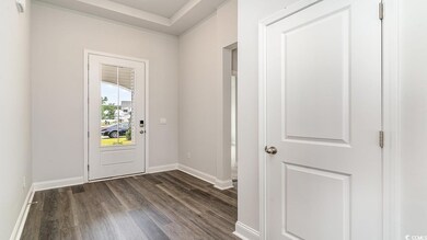 Doorway featuring dark hardwood / wood-style floor