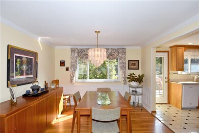Wainscoting and hardwood floors highlight the spac