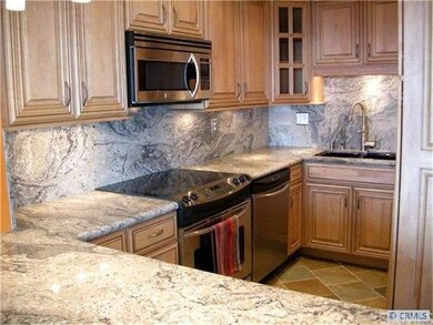 Beautifully remodeled kitchen with slab granite co