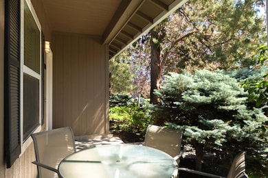 Covered Porch with Mature Landscaping