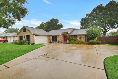 You'll enjoy ample parking with an extra wide driveway leading to the 2-car attached garage. Other noteworthy features include the beautifully landscaped flowerbeds complete with landscape lighting, plus a rear gate that opens directly to Friendswood High School.