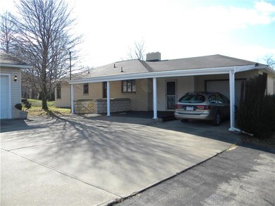 Carport, 1 car attached garage, and 3 car detached