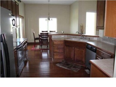 Kitchen has hard wood floors and beautiful maple w