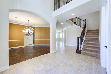 Another side of the foyer with a view of the dining room on the left.