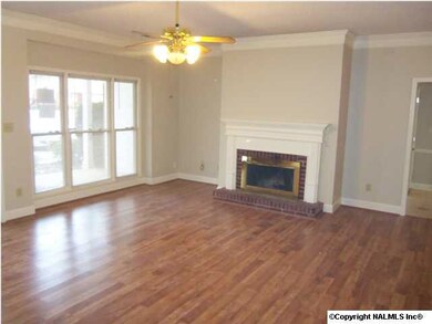 Lving room with fireplace, 9' ceilings and ceiling fan