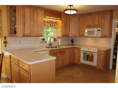 Kitchen - Lots of new maple cabinets and corian co