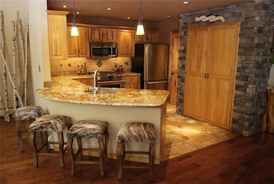Open kitchen with Italian granite counters and tra