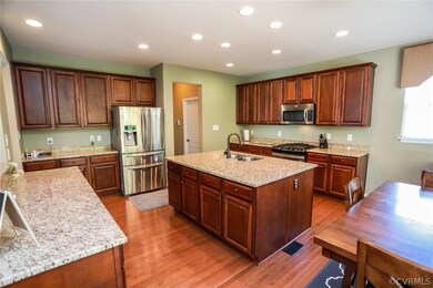 Spacious Eat-In Kitchen with 2 Granite Islands ope