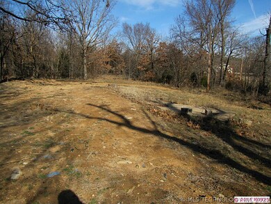 Another view of land surrounded by trees on all si