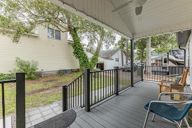 Wooden deck featuring ceiling fan