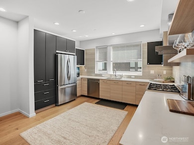 Spacious, modern kitchen is gorgeous & bright.