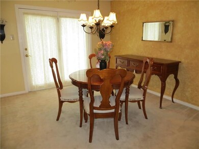 Formal Dining Room w/Glass Door to Concrete Patio.