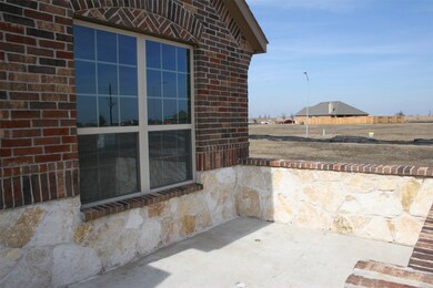 Stone enclosed patio for great outdoor opportunities to socialize.