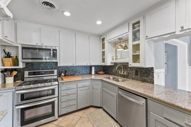 Kitchen offers recessed lighting, double oven, mic