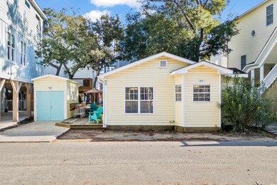 View of front facade with a storage unit and a woo