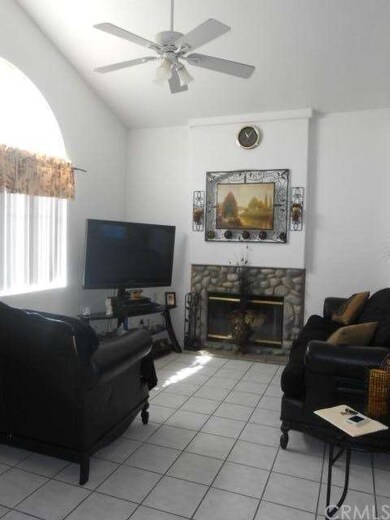 Stoned Fireplace in Family Room...with ceiling fan