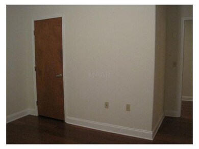 The second bedroom has hardwood flooring as well.