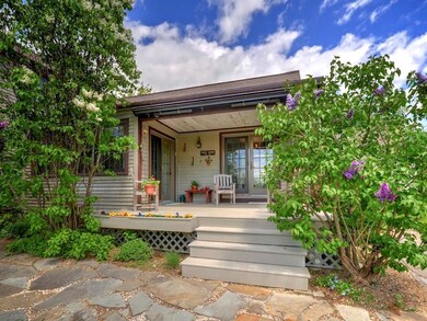 Covered porch with retractable awning