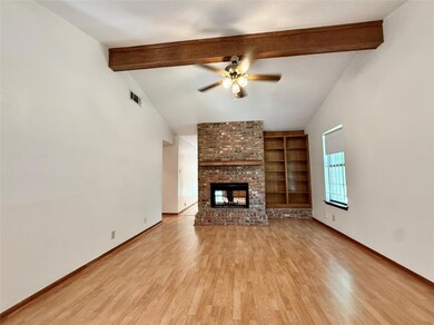 Unfurnished living room featuring a ceiling fan, 