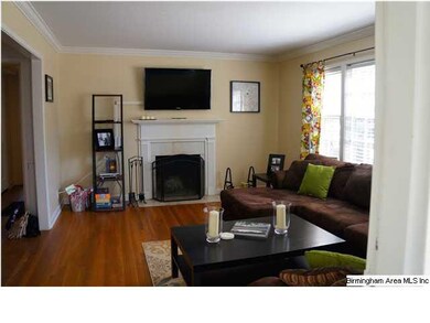 Living room with fireplace and lots of light!