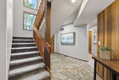 Stairway to Great Room and Primary Suite