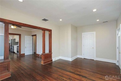 Living room - view showing door to 1st floor bedroom.