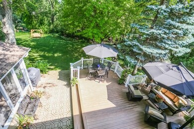 TIMBER TECH DECK WITH LIGHTED RAILS & BRICK PATIO