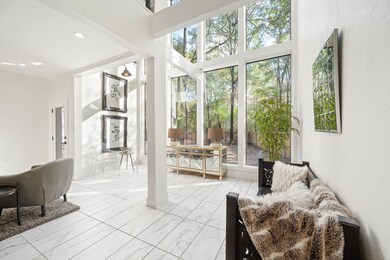 The 1st-floor living space features high ceilings