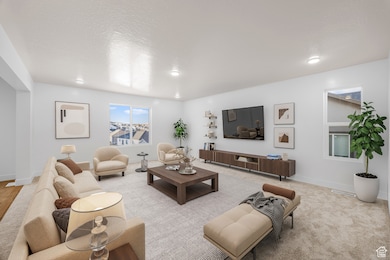 Carpeted living area with a textured ceiling and baseboards