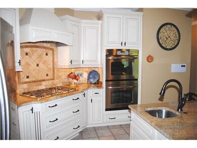 Beautiful backsplash, gas cooking, and stainless d