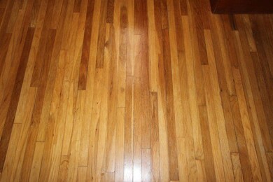 There are hardwood floors throughout the living ro