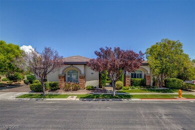 Front view, 3 car garage, one story, lush mature l