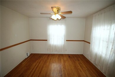 The hardwood floors continue into the dining room 