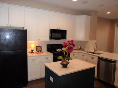The white Shaker cabinets with subway tile backspl