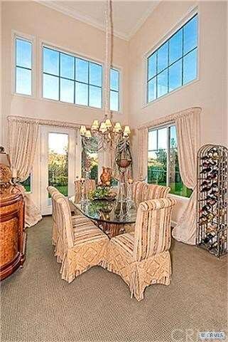Spacious Formal Dining Room with 2 story ceilings 