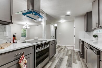 Kitchen with appliances with stainless steel finis