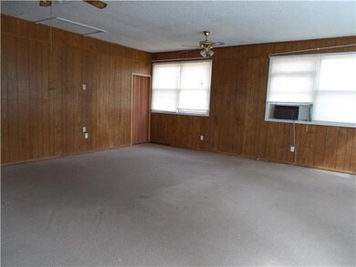 HUGE den, this home is spacious! Just needs some work