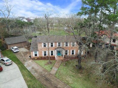 This grand home sits at the end of a cul-de-sac and has a large, oversized garage
