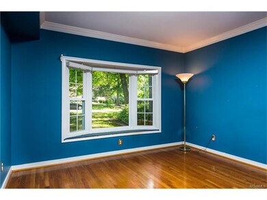 Formal living room with bay window, hardwood floor