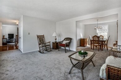 Living room opens to the dining room.
