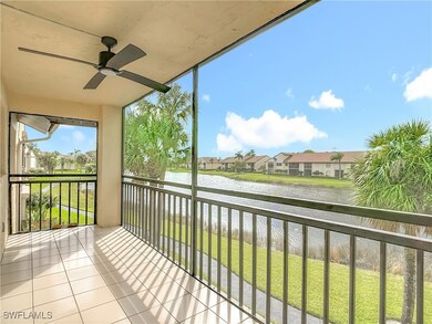 Balcony with a water view, ceiling fan, and a sunroom