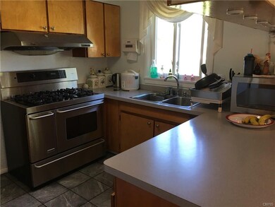 Kitchen with tiled floor and upgraded oven/stove/r