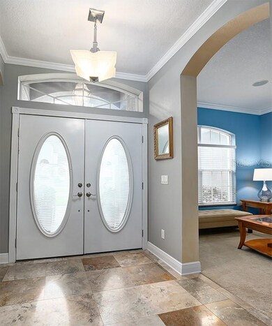 Tiled foyer, arches, 9 foot ceilings throughout.