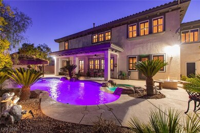 Rear view of house with a patio, a fire pit, an ou