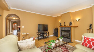 Living Room with Beautiful Hardwood Floors and Crown Molding