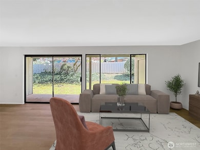 Sliding doors with new blinds that lead to your private back patio.