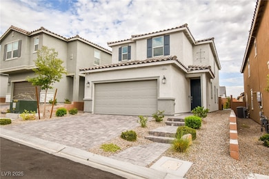 Mediterranean / spanish-style house featuring a ga