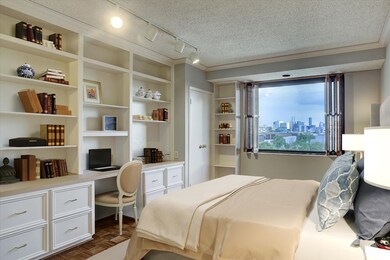 The bedroom also has built-ins and a dressing tabl
